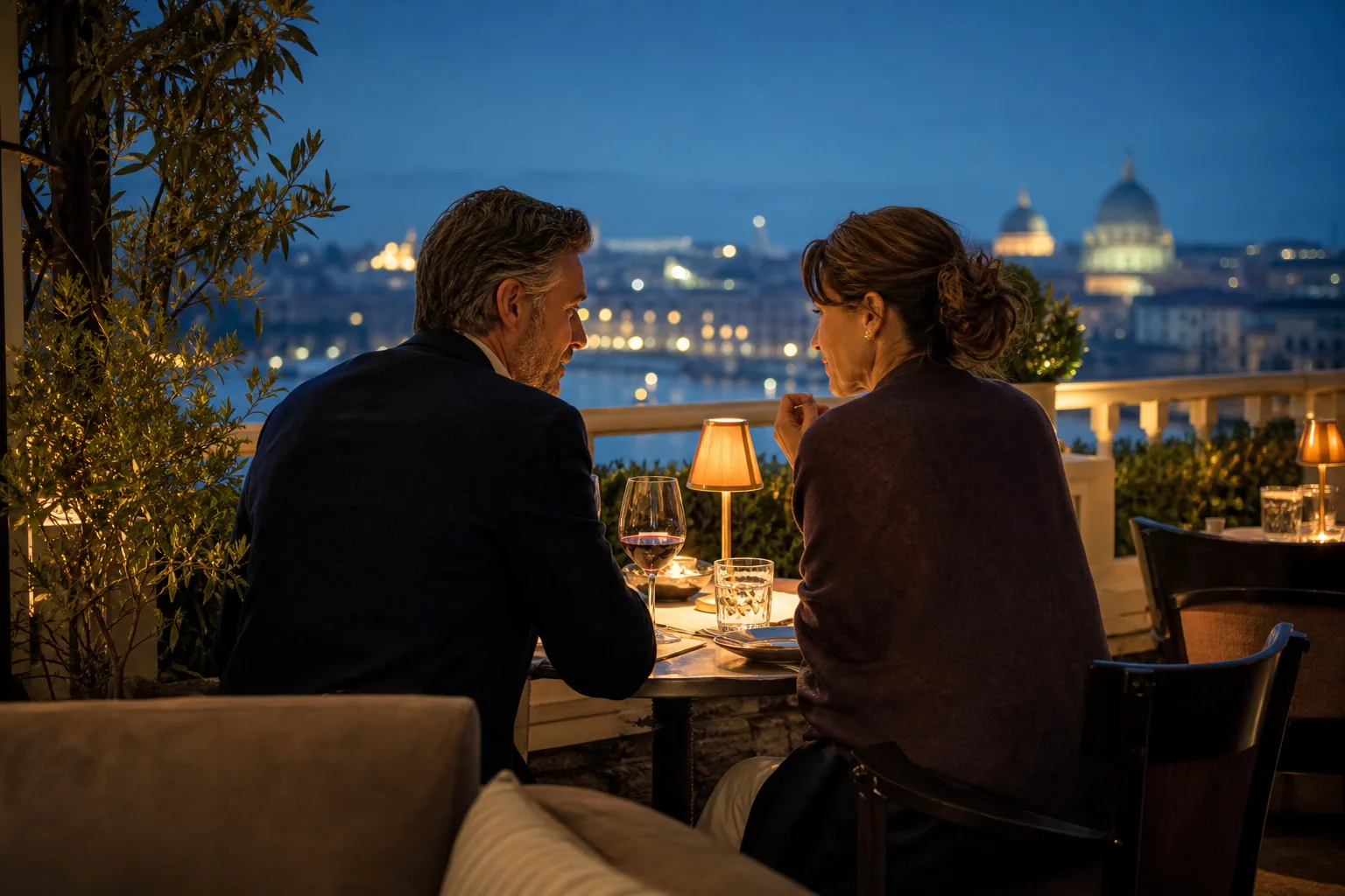 Two adults having a private conversation in an elegant restaurant